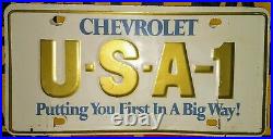 Chevrolet USA-1 VINTAGE embossed metal vanity license plate. NICE! Little Warped