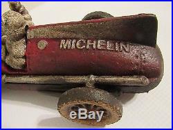 Vintage 1934 Cast Iron Hubley Michelin Man Driving a Race Car