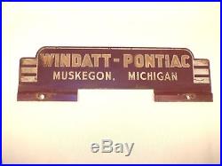 Vintage Pontiac Car Dealer License Plate Topper Emblem Advertising Muskegon MI